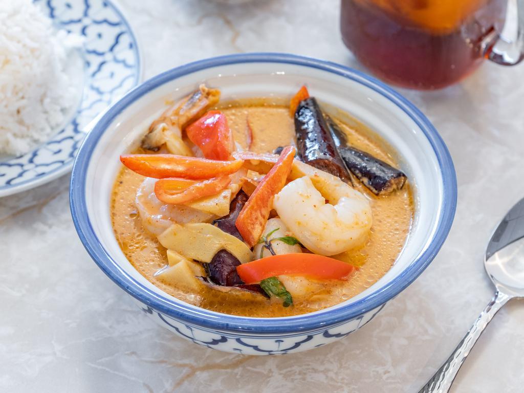 33. Red Curry · Eggplant, bamboo shoots, bell pepper and basil with homemade red Thai chili. Spicy.