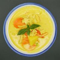 34. Yellow Curry · Thai yellow curry paste with coconut milk, onion, potato and carrots. Spicy.