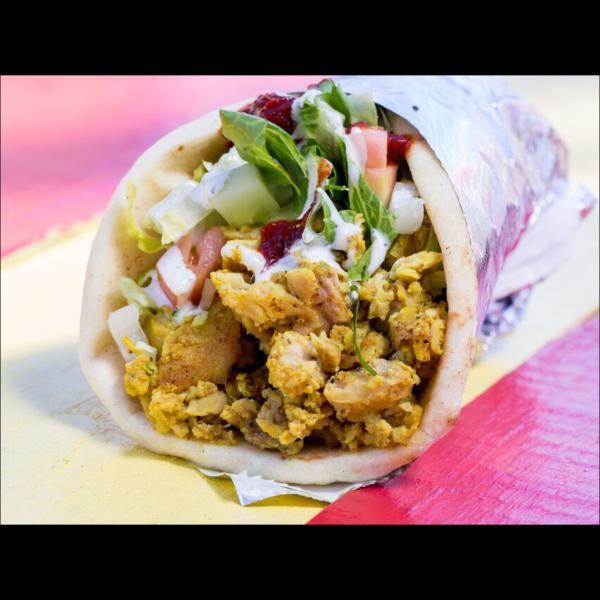 10. Chicken Wrap · Marinated chicken chopped and grilled with lettuce, tomato, cucumbers in pita bread. Includes signature white sauce and hot sauce.