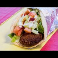 12. Falafel Wrap · Deep fried veggie balls made fresh to order wrapped with lettuce, tomato, cucumbers in pita ...