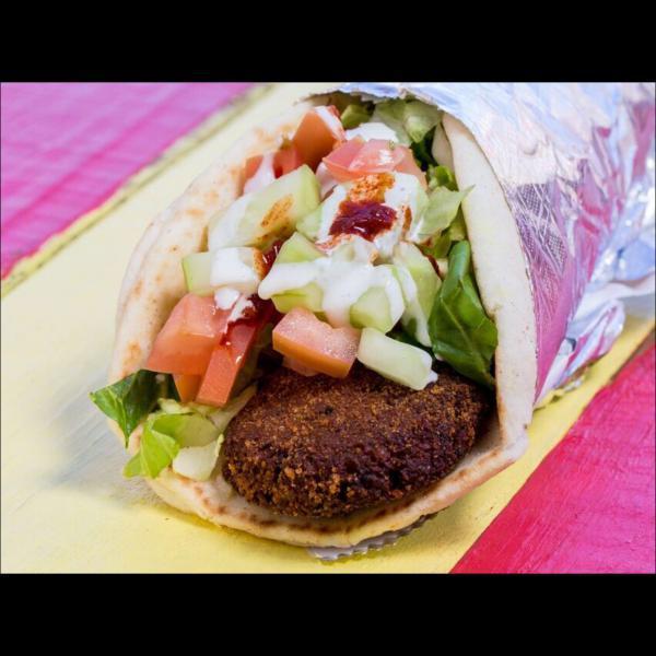 12. Falafel Wrap · Deep fried veggie balls made fresh to order wrapped with lettuce, tomato, cucumbers in pita bread. Includes signature white sauce and hot sauce.