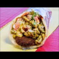 14. Chicken and Falafel Wrap · Grilled thinly sliced chicken, fried veggie balls with lettuce, tomato, cucumbers in pita br...
