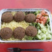 Falafel Over Rice Plate · Fried veggie balls, made fresh to order, over spiced basmati rice and side salad. Includes s...