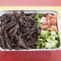 Lamb shawrma over rice · Lamb marinated, slowly roasted and thinly sliced over basmati rice and a side salad. Include...
