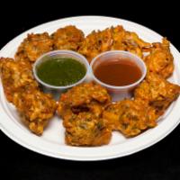 Pakora Plate · Mixed vegetable fritters in a fresh chickpea batter with special Indian seasoning. Served wi...