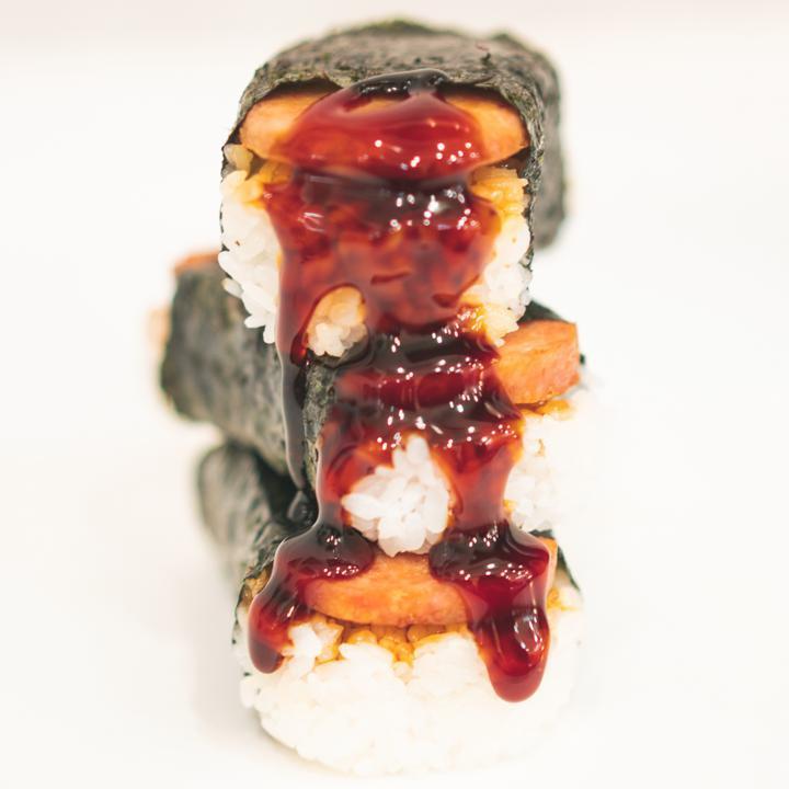 Spam Musubi · Hawaiian Classic! SPAM sandwiched between rice and sauce then wrapped in nori.