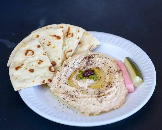 6 oz. Hummus · Chickpea and sesame tahini dip with garlic and lemon served with 1 fresh grilled pita.