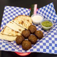 Falafel · Chickpea and veggie fritter lightly fried, served with fresh grilled pita, sesame tahini sau...