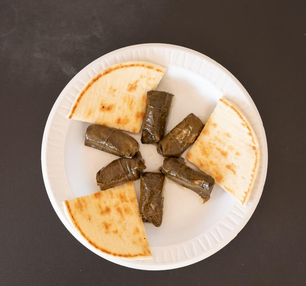 Dolmas ( Grape Leaves ) · 6 Grape leaves stuffed with seasoned rice, served with fresh grilled pita and choice of sauce