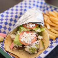 Falafel Pita Sandwich · Lightly fried chickpea and veggie fritter, lettuce, tomato, and house-made pickles served on...