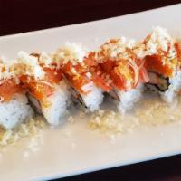 Crunchy Spicy Tuna Roll · California roll wrapped with spicy tuna and kanikoma wrapped a top sprinkled with crunch tem...