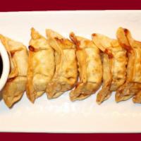 12. Fried Dumpling · Stuffed chicken and vegetables, wrapped with wonton skin, lightly fried and served with dump...