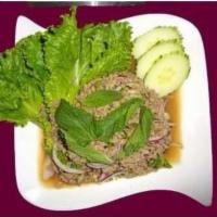 20. Larb Salad · Chicken or pork. Minced chicken or pork, spiced with chili, red onions, cilantro, roasted ri...