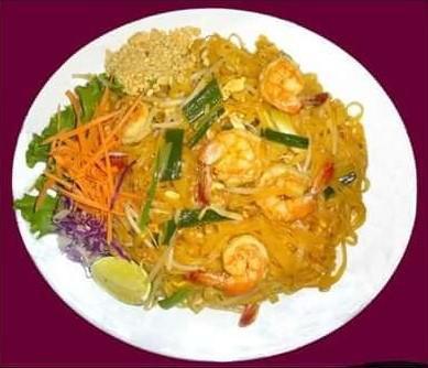 45. Pad Thai · Stir-fried thin rice noodles in tamarind sauce with egg, green onions and bean sprouts, crushed peanuts.