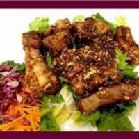 59. Garlic Pepper Pork Spare Ribs · Garlic and peppers sauce. Spicy level 0 to 10