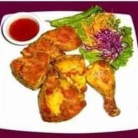 60. Thai BBQ Chicken · 1/2 marinated in Thai herbs grilled to perfection served with sweet and sour sauce.