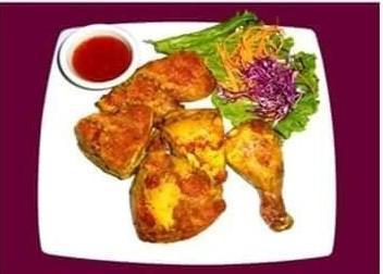 60. Thai BBQ Chicken · 1/2 marinated in Thai herbs grilled to perfection served with sweet and sour sauce.