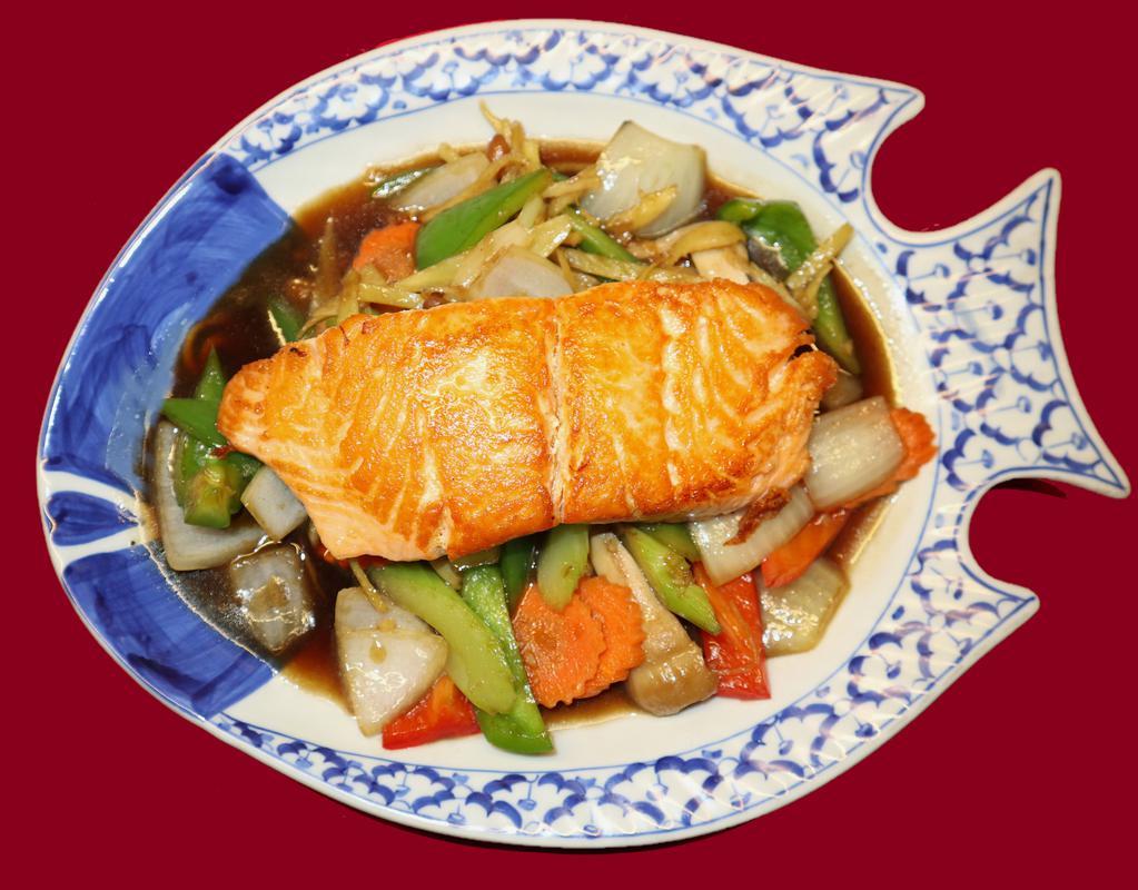 64. Ginger Salmon · Grilled salmon fillet topped with stir fried fresh ginger root, carrtos, celery, green and brwon onions.