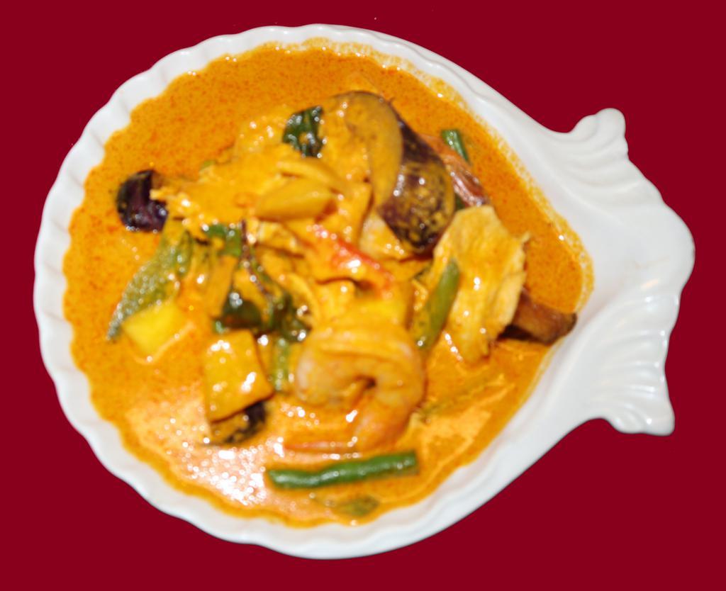 65. Mango Shrimp and ChickenCurry · Red chili paste in coconut milk, shrimp and chicken, fresh mango, green bean, bell pepper, eggplant and fresh Thai basil. Spicy.