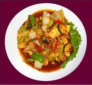 32. Cashew Nuts · Stir fried fresh Thai chili, Thai chili paste with garlic onion, carrot, celery, zucchini, green onion and cashew nut. Spicy.