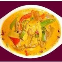39. Red Curry · Red chili paste in coconut milk, bamboo shoots, bell peppers and fresh Thai basil. Spicy.
