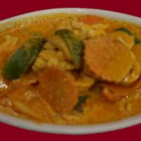 43. Panang Curry · Panang chili paste in coconut milk cooked with bell peppers, carrot snd fresh Thai basil. Sp...