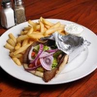 Beef Gyro Sandwich · On pita with lettuce, tomatoes, onions, and side of french fries.