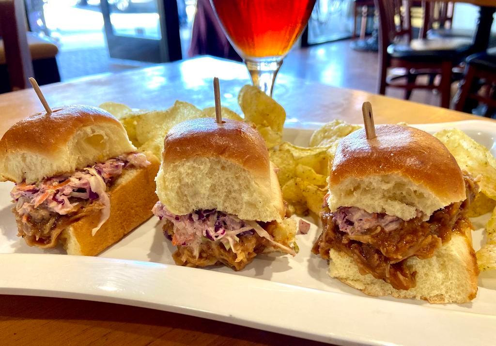 Pulled Pork Slider plate · Pulled pork with special BBQ sauce, served with creamy Cole slaw on Brioche bun (Three sliders)