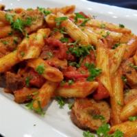 Penne and Salsiccia · Penne pasta tossed with a hearty spicy homemade sausage, sweet red bell peppers, onions, San...