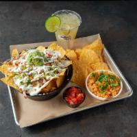 Build Your Own Super Nachos Combo · Home made chips, 1 meat, beans, and queso.