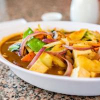 Vegan Curry · Tofu stir fried with white onion, broccoli, snow peas, bok choy, mushroom, bamboo shoots, po...