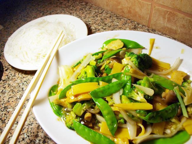 Buddha Delight · Tofu stir fried with white onion, broccoli, snow peas, mushrooms, bamboo shoots, and carrots in our house vegan sauce.  Served with vermicelli or steamed rice.