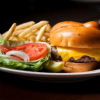 Classic Cheeseburger · Shredded lettuce, beefsteak tomato, choice of raw or grilled onions, french fries.