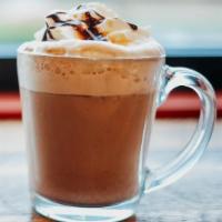 German Chocolate Delight · Dark Chocolate, Caramel, and Coconut, white coffee shots, steamed 2% topped with whipped cre...
