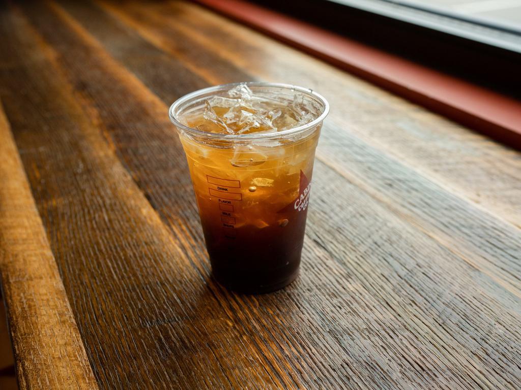 Iced Americano · Double espresso shot over ice and water.