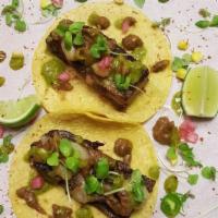 Tacos de Costilla & Tuétano · Beef short ribs, bone marrow, roasted red onion-jalapeño chile toreado salsa