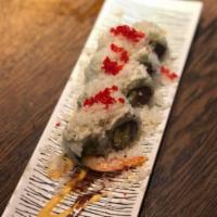 Bomb Roll · tempura shrimp, tuna, avocado—
topped with krab delight,
red tobiko roe, tempura flakes, e...
