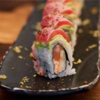 Smoky Dragon Roll · salmon, krab delight, red
onion, cucumber, tempura flakes—
topped with avocado, torched tu...