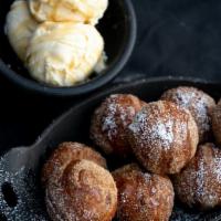 Churro Balls · deep fried dough dusted with sugar & spcies, served a la mode with a side of chocolate dripp...