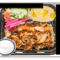 Chicken Shawarma Plate · Marinated chicken served with French fries or rice, salad, hummus, garlic sauce, pickles, an...
