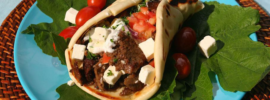 5. Beef Shawarma Gyro لحم جـايرو · Shredded beef, tahini sauce, onion, lettuce, parsley, tomato, and pickles.