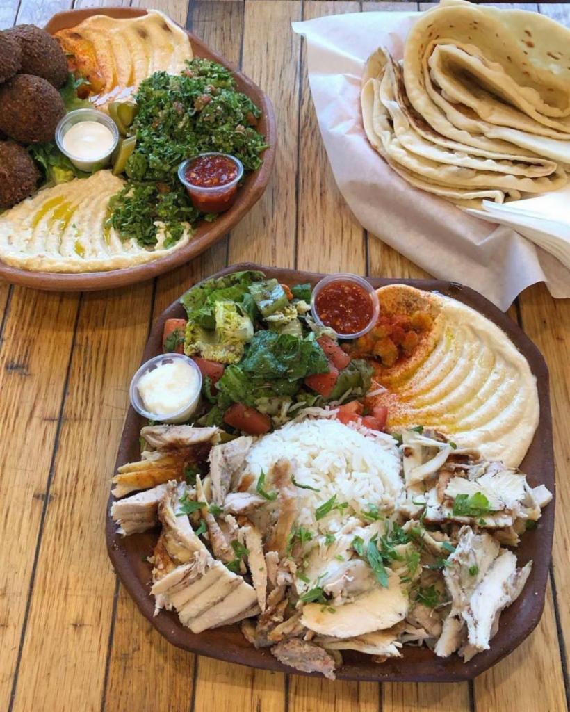 20. Chicken Shawarma Plate صحن دجاج · Marinated chicken served with salad and rice, onion, tomato, lettuce, tzatziki, hummus, and choice of sauce.