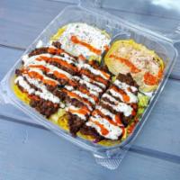 25.Spicy Kafta Kabab over Rice Plate · Kafta, rice, mix salad, tzatziki, hummus, and choice of sauce.