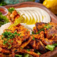 26. Combo Kabab over Rice Plate  · Chicken shawarma, beef kabab, rice, mix salad, tzatziki, hummus and choice of sauce.