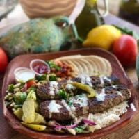 25. Beef Kabab over Rice Plate  · Beef, rice, mix salad, tzatziki, hummus, and choice of sauce.