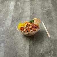 Ninja Chicken Poke · Chicken, corn, romaine lettuce, cucumber, red onion, pickled carrot, sweet chili and spicy g...