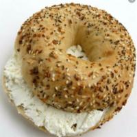 Toasted Bagel with Cream Cheese · Boiled and baked round bread roll. Soft mild cheese.