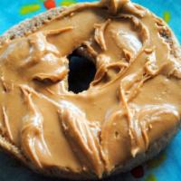 Toasted Bagel with Local Peanut Butter · Boiled and baked round bread roll.