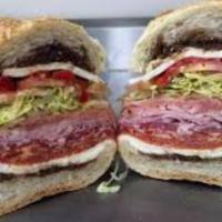 Italian Grinder · Prosciutto, salami, pepperoni, provolone, lettuce, tomato, red onion and hot peppers.