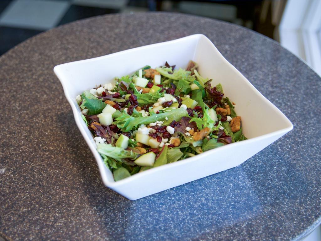 Waldorf Salad · Mixed greens, cranberries, candied walnuts, granny smith apples, goat cheese and raspberry vinaigrette.
